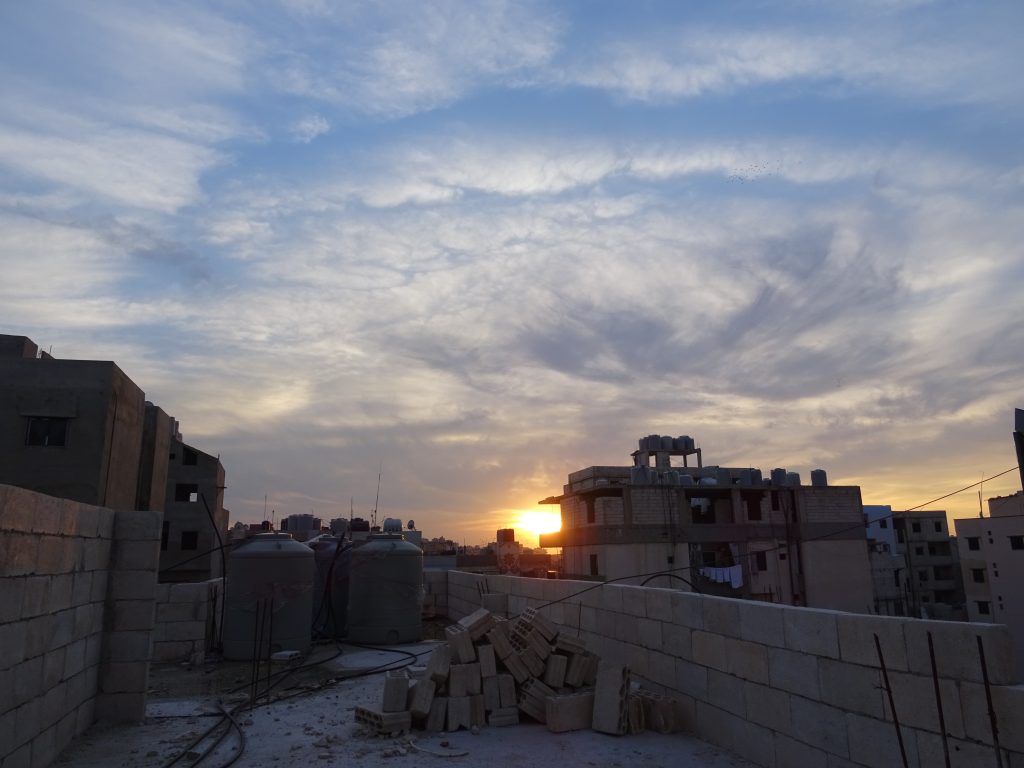 A storm brews over Baddawi refugee camp, North Lebanon. Photo by Elena Fiddian-Qasmiyeh